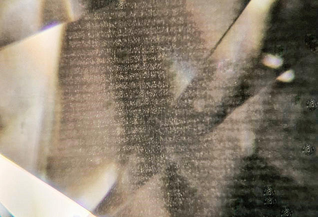 Text-Like Cloud Features in a CVD-Grown Pear-Shaped Diamond