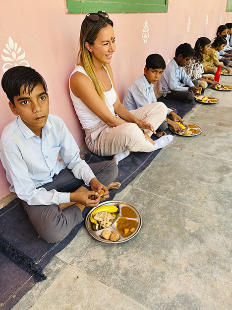 Figure 2. School meal distribution supported by Akshaya Patra in India. Courtesy of Shop LC. Figure 2. School meal distribution supported by Akshaya Patra in India. Courtesy of Shop LC.