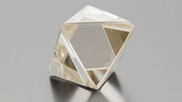 Figure 1. A 6.87 ct CVD-grown synthetic diamond, measuring approximately 11 mm across, fashioned in the approximate shape of an octahedron. Photo by Danny Bowler. Figure 1. A 6.87 ct CVD-grown synthetic diamond, measuring approximately 11 mm across, fashioned in the approximate shape of an octahedron. Photo by Danny Bowler.