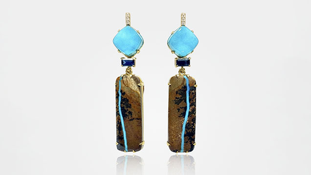 “Nile” earrings featuring a one-of-a-kind pair of Royston River turquoise, chrysocolla druzy, blue spinels, and diamonds in 14K yellow gold. Courtesy of Eleux Jewelry.