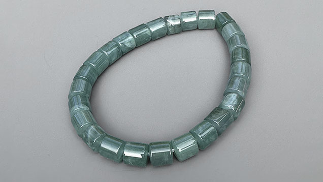 Figure 7. Guatemalan blue jadeite jade bracelet with 6 mm diameter cylindrical beads. Photo by Jennifer Stone-Sundberg; courtesy of Jade West Corp. Figure 7. Guatemalan blue jadeite jade bracelet with 6 mm diameter cylindrical beads. Photo by Jennifer Stone-Sundberg; courtesy of Jade West Corp.