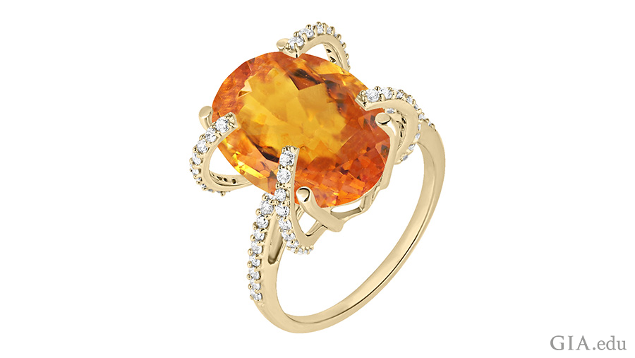 The November birthstone is shown off in this orange oval cut citrine ring with diamonds. The November birthstone is shown off in this orange oval cut citrine ring with diamonds.
