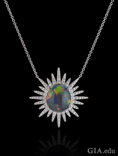 A 6.15 ct black opal in the center with 1.37 cts of diamonds radiating out in a starburst pattern. Set in 18kt white gold. A 6.15 ct black opal in the center with 1.37 cts of diamonds radiating out in a starburst pattern. Set in 18kt white gold.