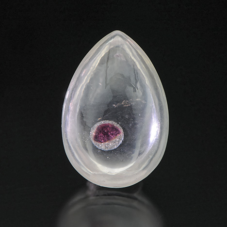 Quartz cabochon with garnet “inclusion”
