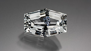 Brazilian colorless topaz with molybdenite inclusions. Brazilian colorless topaz with molybdenite inclusions.