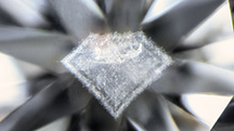 Cloud inclusion resembling the profile of a faceted diamond. Cloud inclusion resembling the profile of a faceted diamond.
