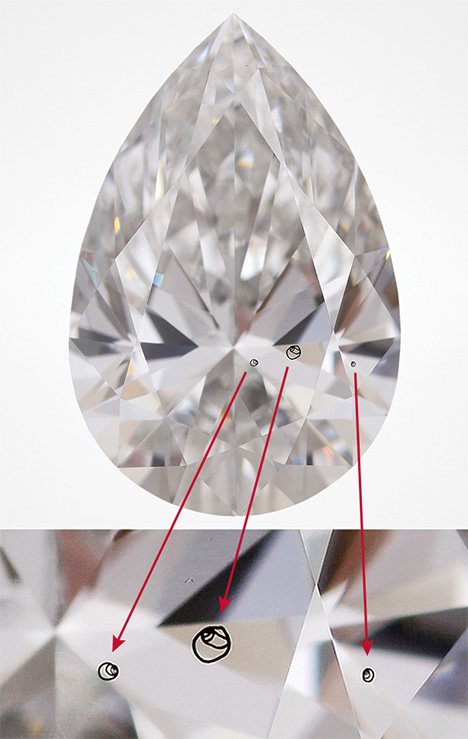 CVD-grown diamond with internal laser markings.