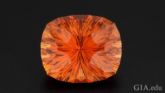 A bright orange, multi-faceted gem.