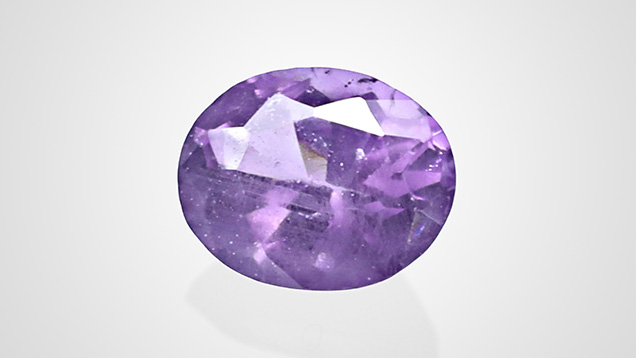 Figure 1. This faceted purple spinel, weighing 0.51 ct and measuring 5.20 × 4.17 × 3.10 mm, was reportedly from Tanzania. Photo by Jinlin Wu.