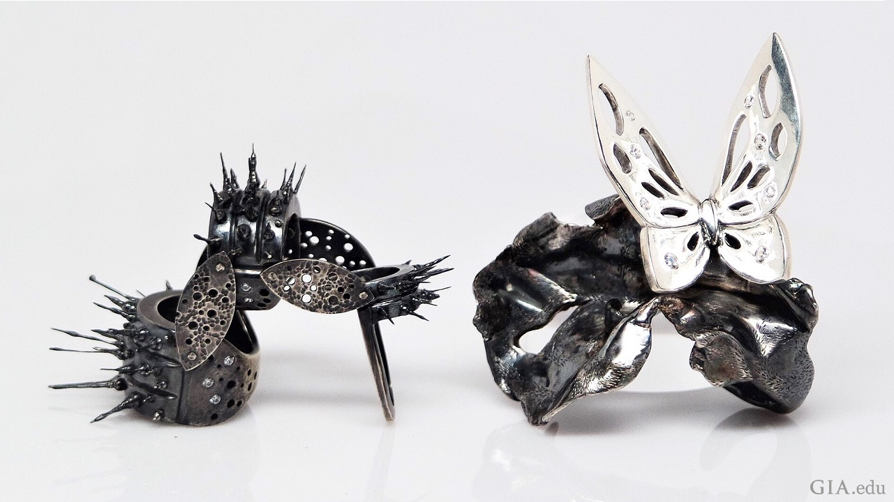The caterpillar ring on the left is jointed so it can move and the butterfly ring on the right features dark and light sterling silver: a light butterfly on a dark cocoon.