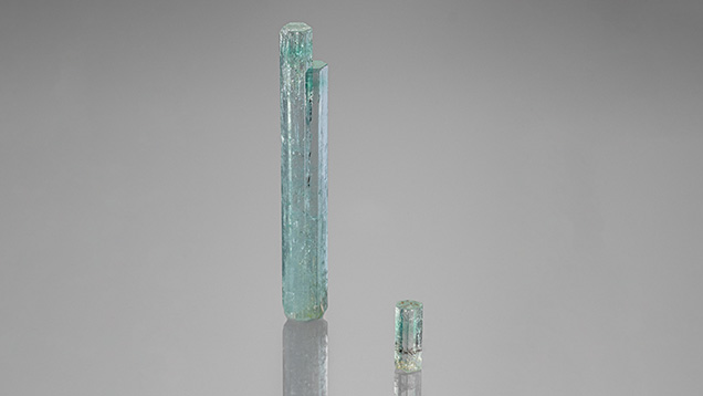 Green beryl crystals weighing 41.90 ct (left) and 4.08 ct (right) from a new source in Nigeria display concentrated color zones. Photo by Rhonda Wilson; courtesy of Rhonda Wilson (left) and Maxwell Hain (right). Green beryl crystals weighing 41.90 ct (left) and 4.08 ct (right) from a new source in Nigeria display concentrated color zones. Photo by Rhonda Wilson; courtesy of Rhonda Wilson (left) and Maxwell Hain (right).