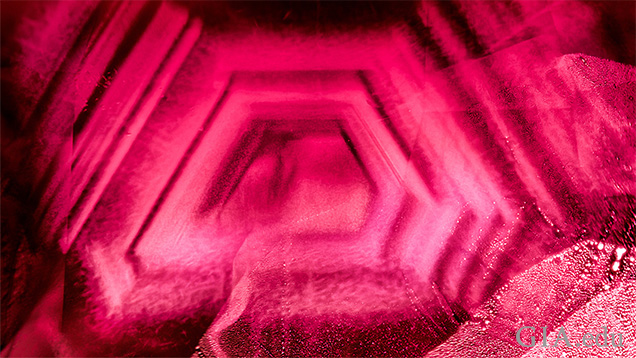 A hexagonal cloud results from heat treating this Burmese ruby from Mong Hsu. Field of view 2.97 mm.
