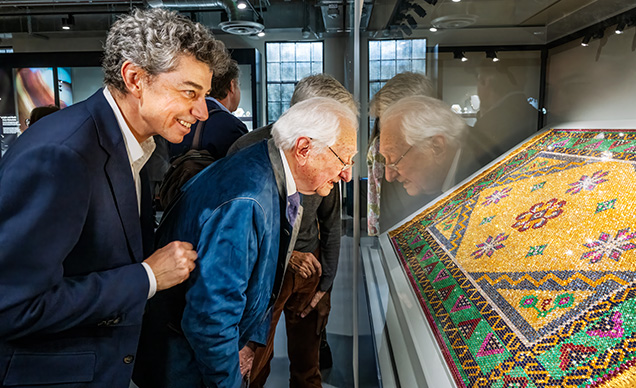Emmanuel and Daniel Piat (right) examine “The Royal Tapestry” together for the first time at the Alfie Norville Gem & Mineral Museum. Photo by Robert Weldon.