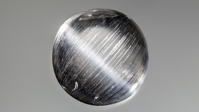 Phenakite with cat’s eye viewed with point-source illumination.