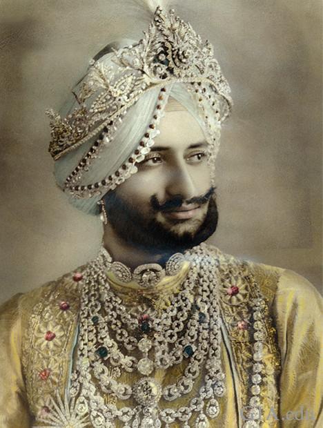 Image of Indian Maharaja wearing ornate jewelry including two necklaces. 