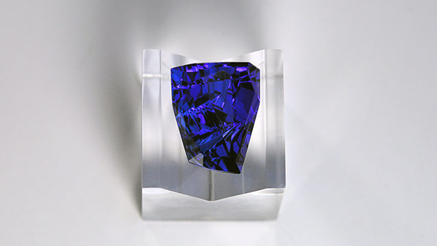 Angled grooves on freeform tanzanite.