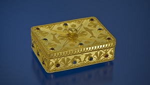 A rectangle-shaped gold box, decorated with filigree, granulation and gems.