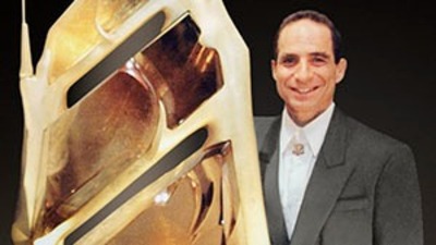 Glenn Lehrer next to the rutilated quartz carving “Bahia,” created with Lawrence Stoller. Glenn Lehrer next to the rutilated quartz carving “Bahia,” created with Lawrence Stoller.
