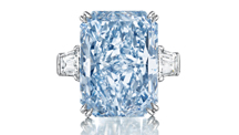 	A 24.18 ct. cut-cornered, rectangular, mixed cut Fancy Intense blue diamond flanked with tapered baguette-cut diamonds.