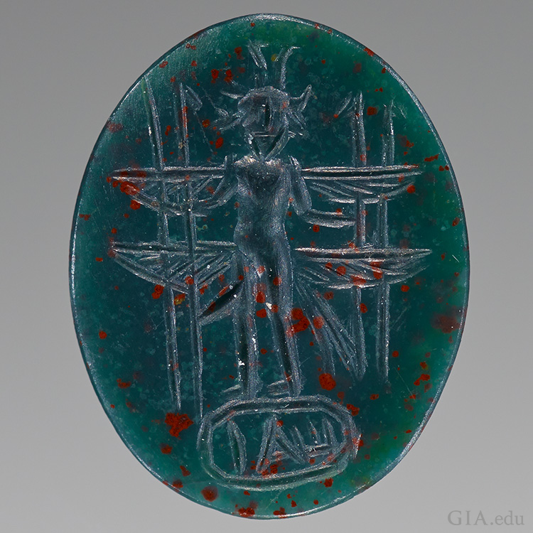 An engraved bullae bloodstone cameo from the Roman Empire features the March birthstone.