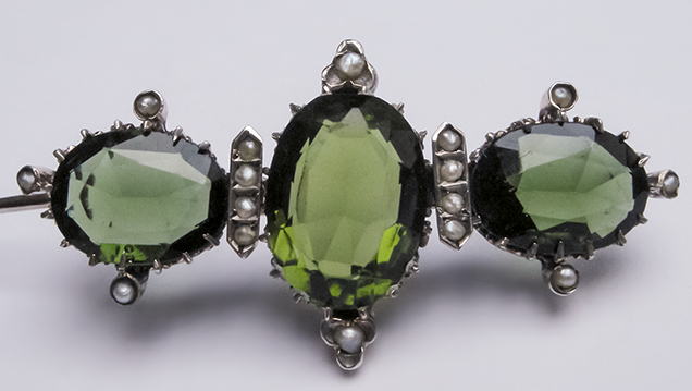 Silver brooch with glass