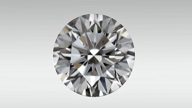Round brilliant diamond showing bright red fluorescence. Round brilliant diamond showing bright red fluorescence.