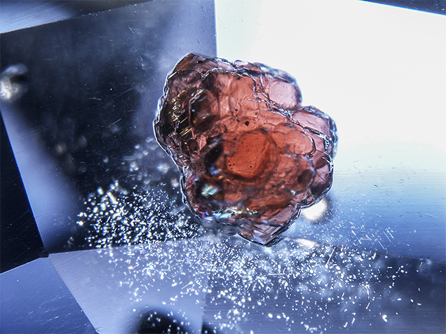 Pyrope-almandine garnet crystal inclusion in sapphire.