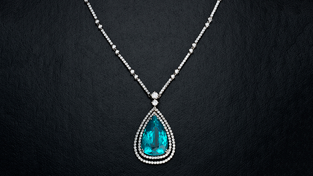 Paraíba tourmaline and diamond pendant necklace. Paraíba tourmaline and diamond pendant necklace.
