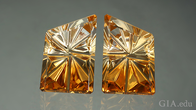 Two pieces of carved citrine that show light to dark from top to bottom. Two pieces of carved citrine that show light to dark from top to bottom.