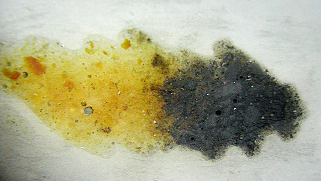 Gas bubbles and spherical pores in the brown and black areas.