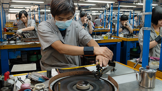 Workers at Chow Tai Fook polish diamonds by hand for greatest precision. Workers at Chow Tai Fook polish diamonds by hand for greatest precision.