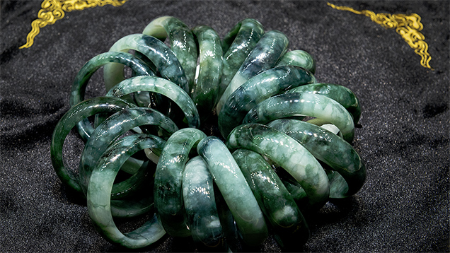 Cluster of color-zoned jadeite bangles in a retail display Cluster of color-zoned jadeite bangles in a retail display