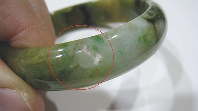 Jadeite bangle showing transparent area Jadeite bangle showing transparent area