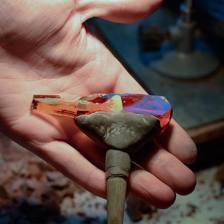 199062-720x720.jpg. To polish the top of the crystal, Alexander attaches it to a dopstick with wax. Photo courtesy Sonja Kreis Unique Jewelry.