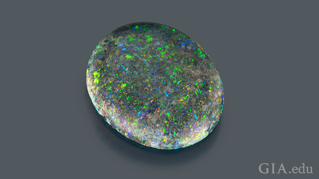 A 1.7 ct oval opal with “pinfire” flecks of color. A 1.7 ct oval opal with “pinfire” flecks of color.