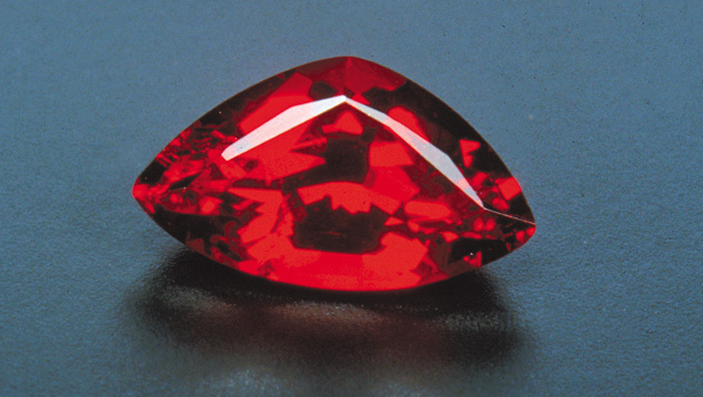 Deep red sunstone from the Ponderosa mine is marketed as spinel red. Although it’s not as hard as spinel or ruby, this sunstone type has a vivid scarlet hue that can be equally lovely. – Bart Curren Deep red sunstone from the Ponderosa mine is marketed as spinel red. Although it’s not as hard as spinel or ruby, this sunstone type has a vivid scarlet hue that can be equally lovely. – Bart Curren