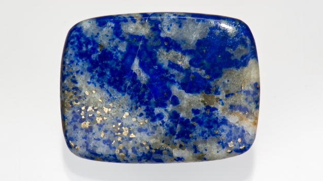 Lapis Lazuli. The calcite matrix in this cabochon will lower its appeal to most buyers. - Robert Weldon