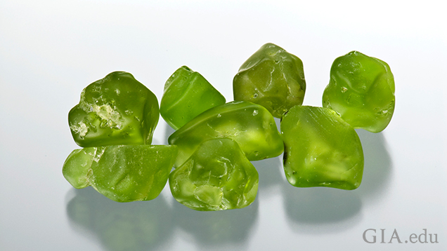 Eight pieces of peridot rough.