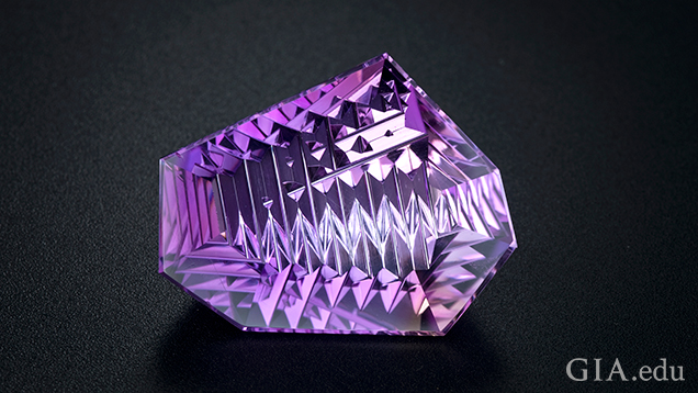 A carved piece of ametrine. A carved piece of ametrine.