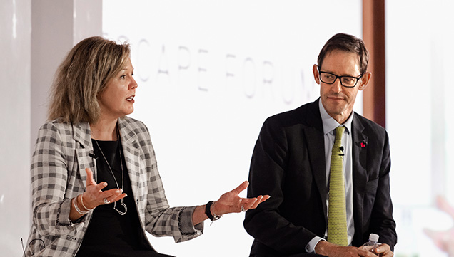 Bruce Cleaver of the De Beers Group listens as Signet Jewelers’ Gina Drosos explains the importance of omni-channel retailing. Photo by Denise Conrad/GIA.