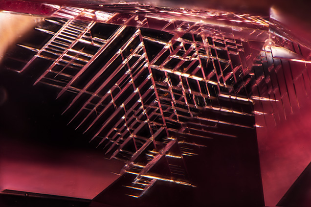 Cleavage along octahedral planes of pink diamond.