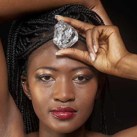 Model posing with Lesotho Promise diamond Model posing with Lesotho Promise diamond