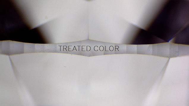 “TREATED COLOR” inscribed on the girdle of the diamond. “TREATED COLOR” inscribed on the girdle of the diamond.