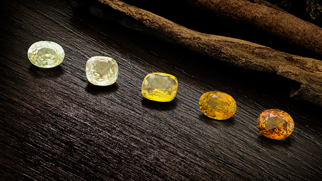 Figure 1. These exceptional natural yellow sapphires from Madagascar (2.1–2.6 ct) represent both the Fe3+ chromophore and the trapped hole paired with Fe3+. Photo by Ronnakorn Manorotkul/Lotus Gemology; courtesy of GemFever. Figure 1. These exceptional natural yellow sapphires from Madagascar (2.1–2.6 ct) represent both the Fe3+ chromophore and the trapped hole paired with Fe3+. Photo by Ronnakorn Manorotkul/Lotus Gemology; courtesy of GemFever.
