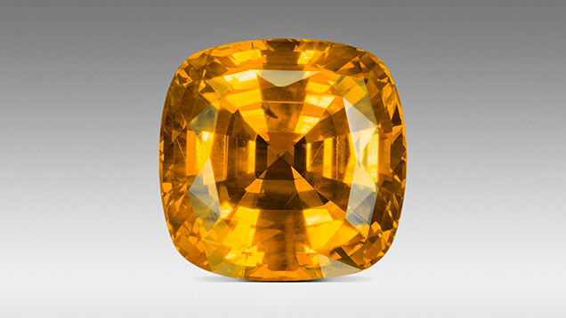 Figure 24. This unusual gem from the Bang Kha Cha deposit is colored by a high concentration of both the Fe3+ and the h•-Fe3+ chromophores. The color is referred to as “Mekong Whisky.” Photo by Ronnakorn Manorotkul/Lotus Gemology. Figure 24. This unusual gem from the Bang Kha Cha deposit is colored by a high concentration of both the Fe3+ and the h•-Fe3+ chromophores. The color is referred to as “Mekong Whisky.” Photo by Ronnakorn Manorotkul/Lotus Gemology.