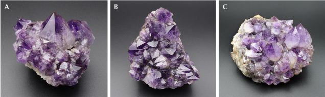 Figure 5. Amethyst from La Manche. A: 9 cm wide with the largest crystal 4 cm tall. B: 11 cm wide. C: Medium purple amethyst, with the largest crystal measuring 4 cm wide. Photos by Philippe Belley. Figure 5. Amethyst from La Manche. A: 9 cm wide with the largest crystal 4 cm tall. B: 11 cm wide. C: Medium purple amethyst, with the largest crystal measuring 4 cm wide. Photos by Philippe Belley.