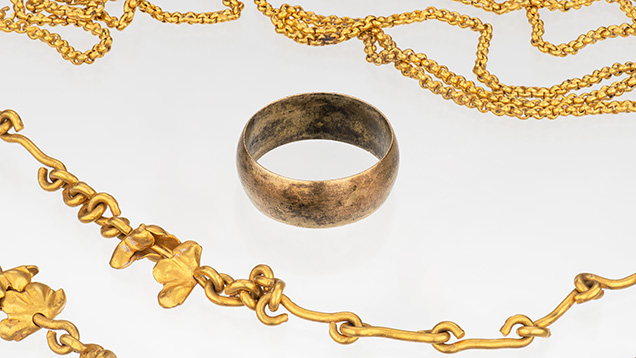Figure 6. Two gold chains and a plain gold ring from the 1715 shipwreck. Photo by Emily Lane. Figure 6. Two gold chains and a plain gold ring from the 1715 shipwreck. Photo by Emily Lane.