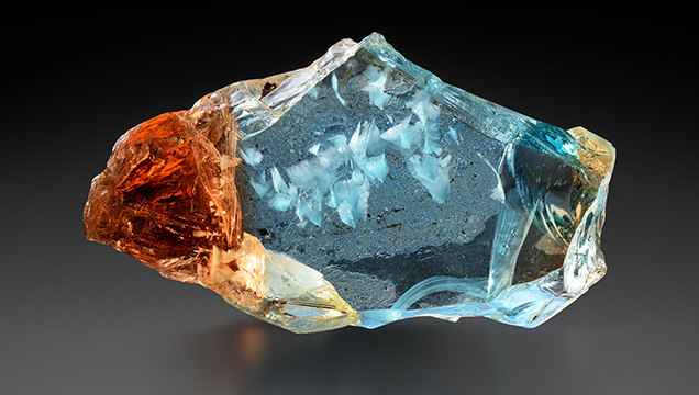 Bicolor topaz with white fluorite inclusions from Ukraine Bicolor topaz with white fluorite inclusions from Ukraine