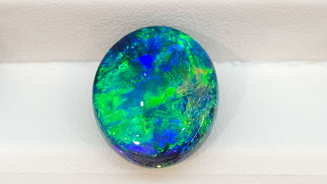Black opal cabochon from Lightning Ridge Black opal cabochon from Lightning Ridge