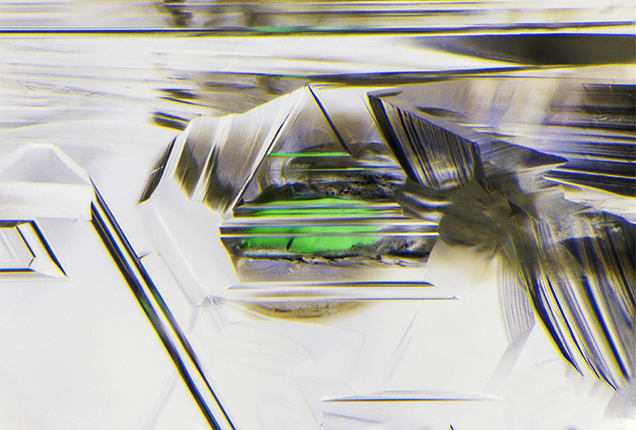 Rounded, etched chromium diopside inclusion in diamond.
